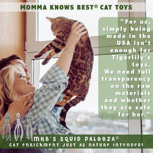 Couple holding Bengal cat in the air with MKB's catnip squid toys